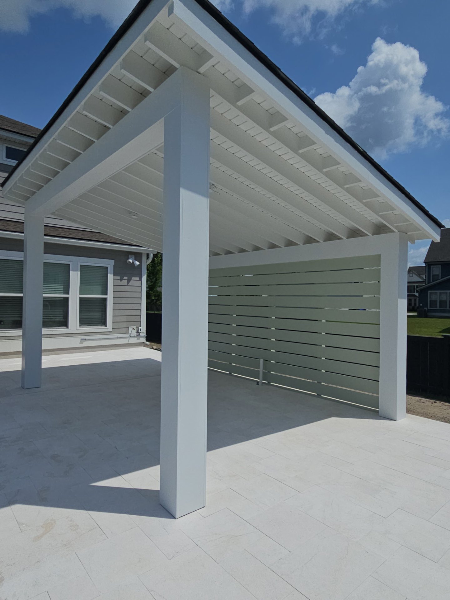 Hip roof cover engineered for storms and salt air.